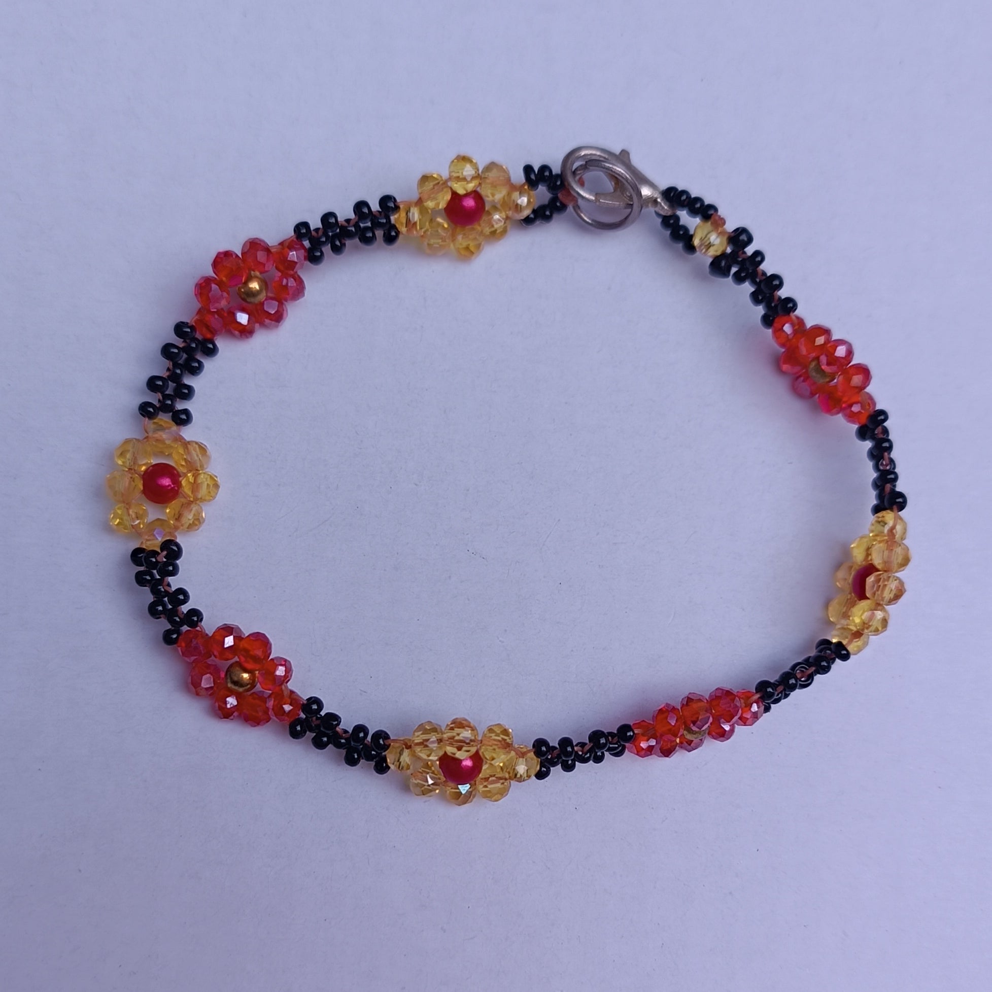 Handmade Black Seed-Bead Bracelet with Red & Yellow Flower Accents