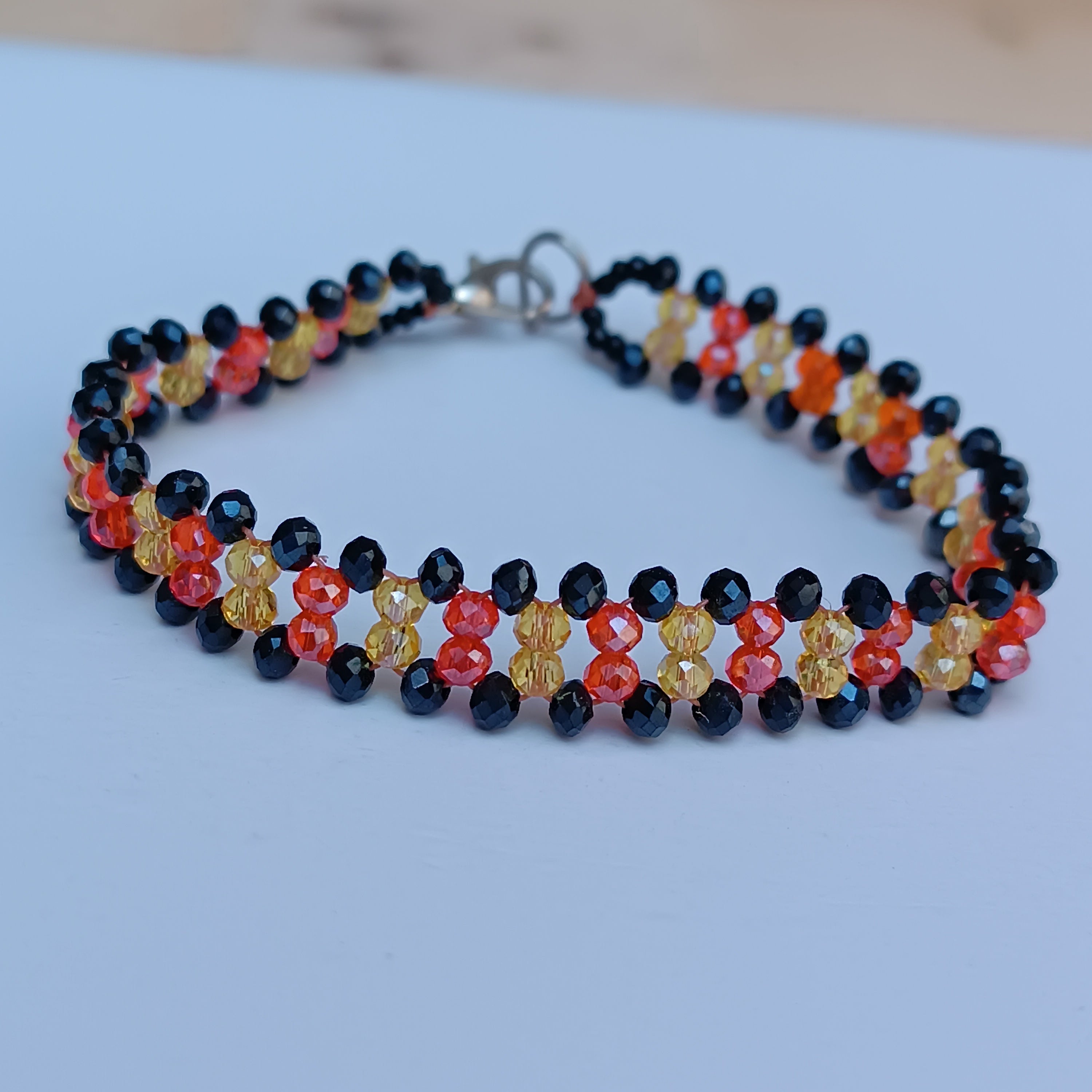 Handmade Crystal Beaded Bracelet – Black, Orange & Yellow