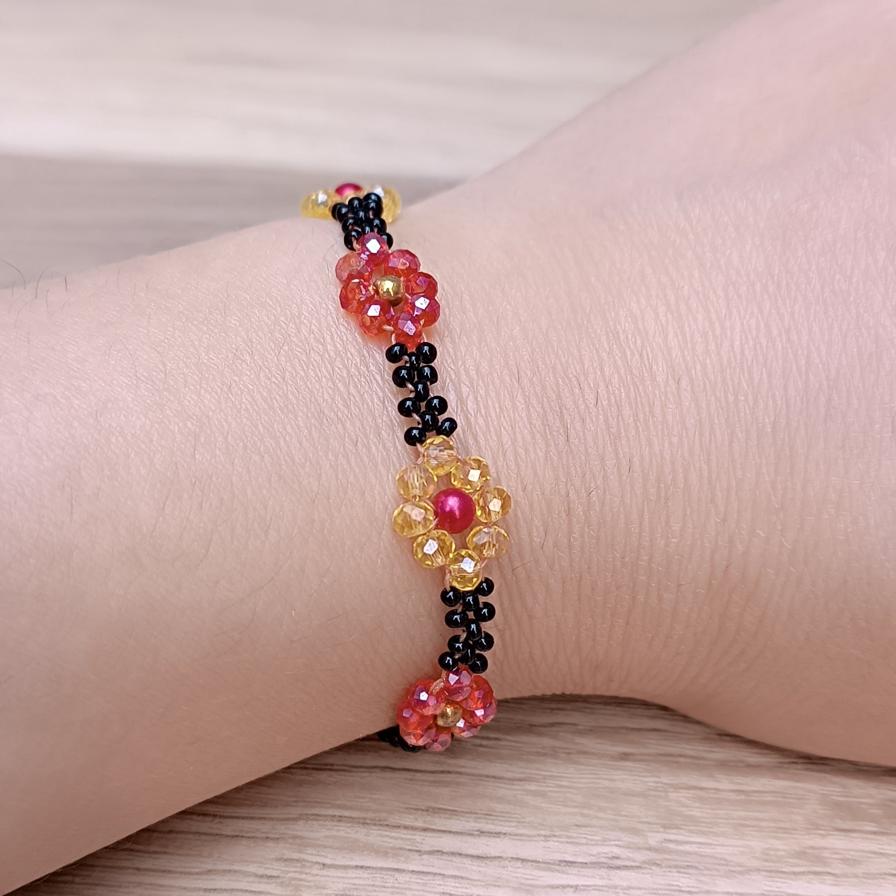 Handmade Black Seed-Bead Bracelet with Red & Yellow Flower Accents